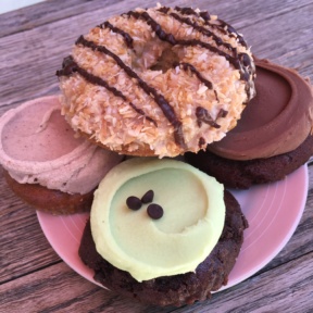 Gluten-free cupcake tops and donut from Erin McKenna's Bakery